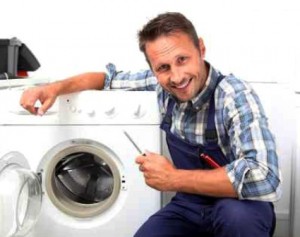 Plumber fixing broken washing machine