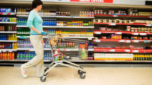 Shopper with Cart in Supermarket